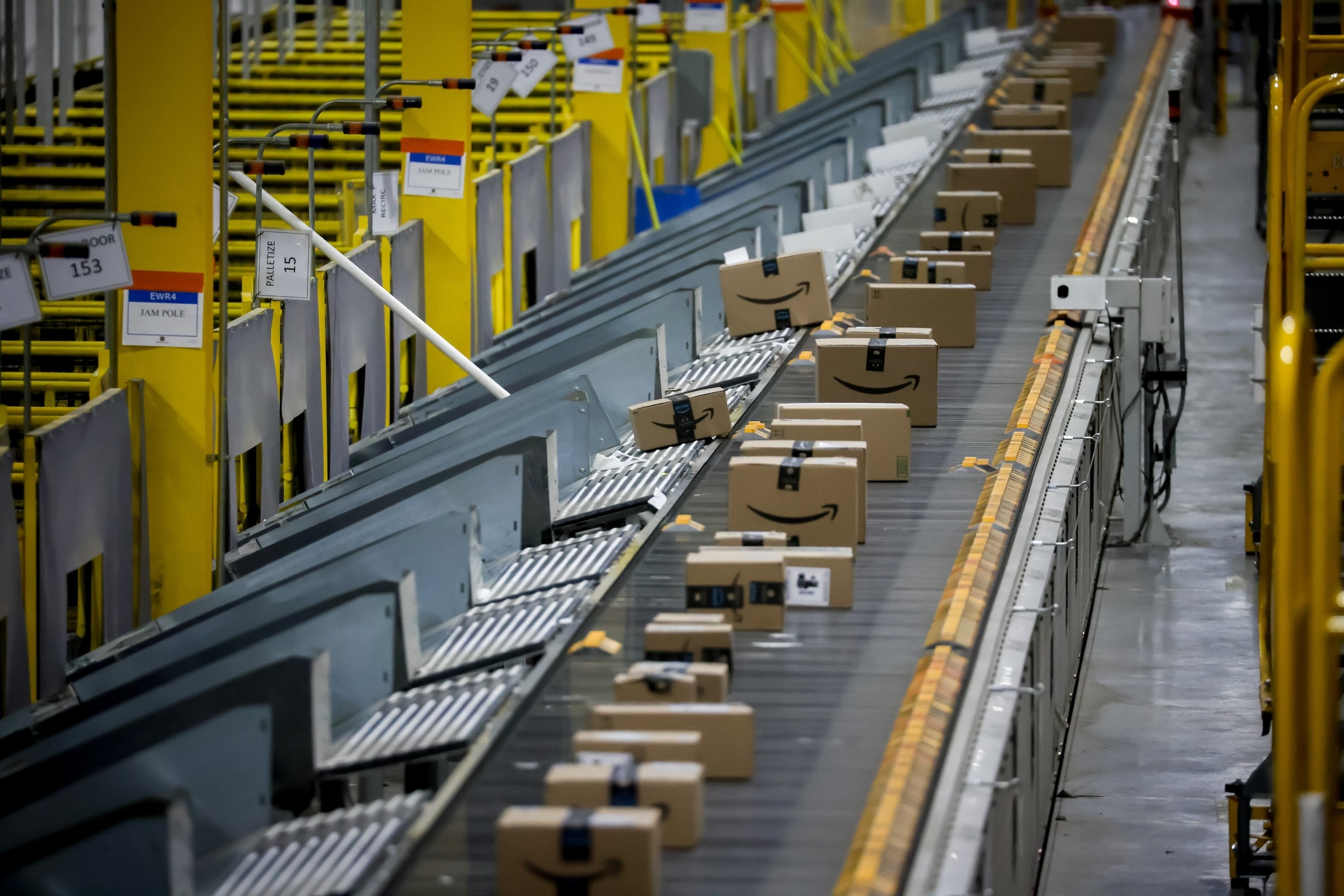 Packages on a conveyor belt are automatically sorted for shipping at an Amazon fulfillment center on Cyber Monday in Robbinsville, New Jersey, Dec. 1, 2025.Bloomberg via Getty Images