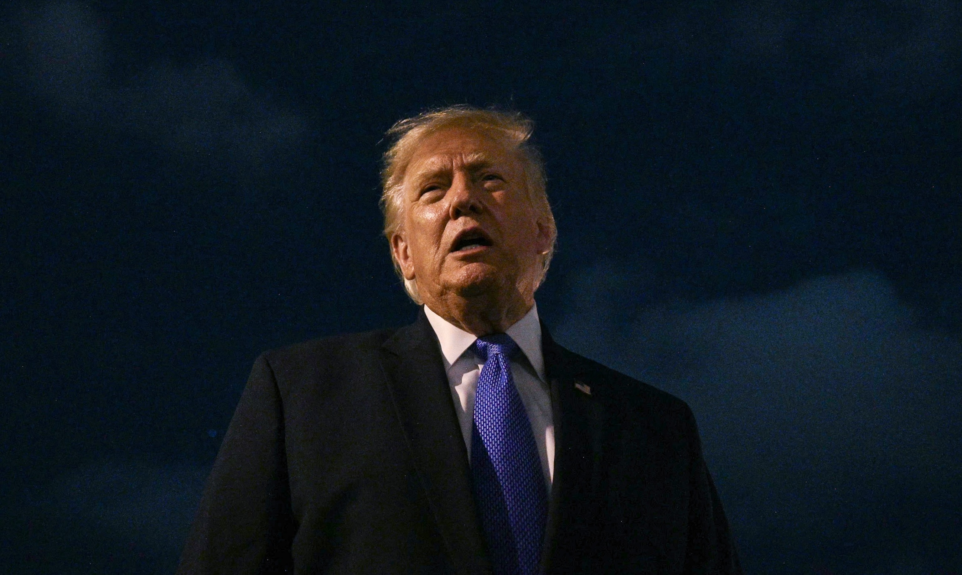 President Donald Trump talks to reporters before he boards Air Force One, Aug. 4, 2026, at Los Angeles International Airport.Jim Watson/AFP via Getty Images