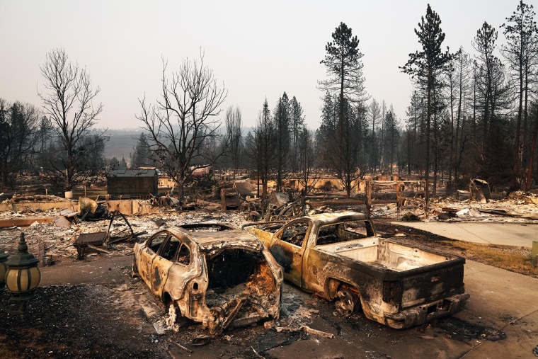 Dozens of homes are burned to the ground after a wildfire hit the northern part of Spokane on Monday.Lindsey Wasson / AP