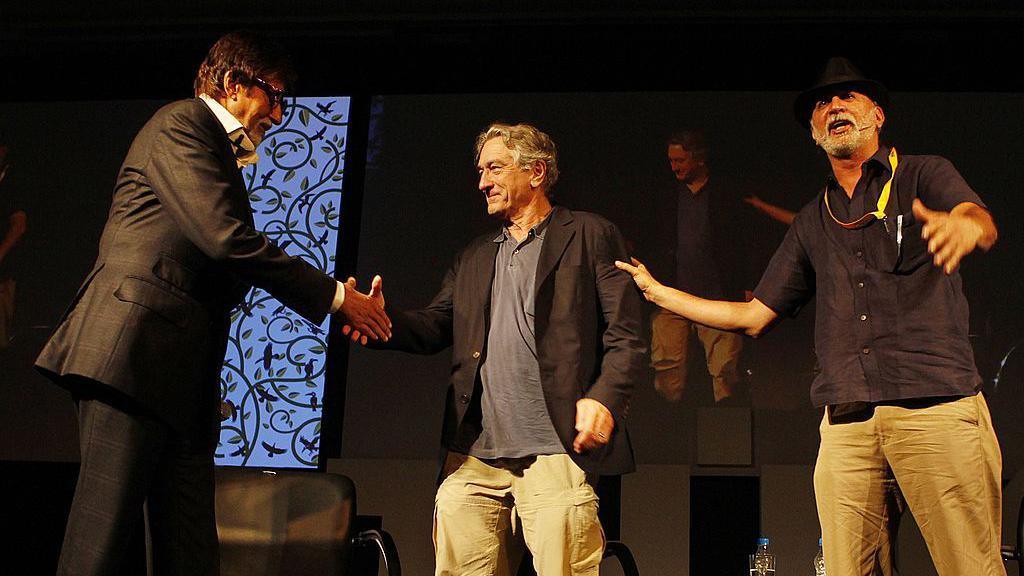Image caption,The incident involving Tejpal (right) took place at Tehelka's high-profile 2013 conference, attended by Robert De Niro (centre) and Amitabh Bachchan (left)