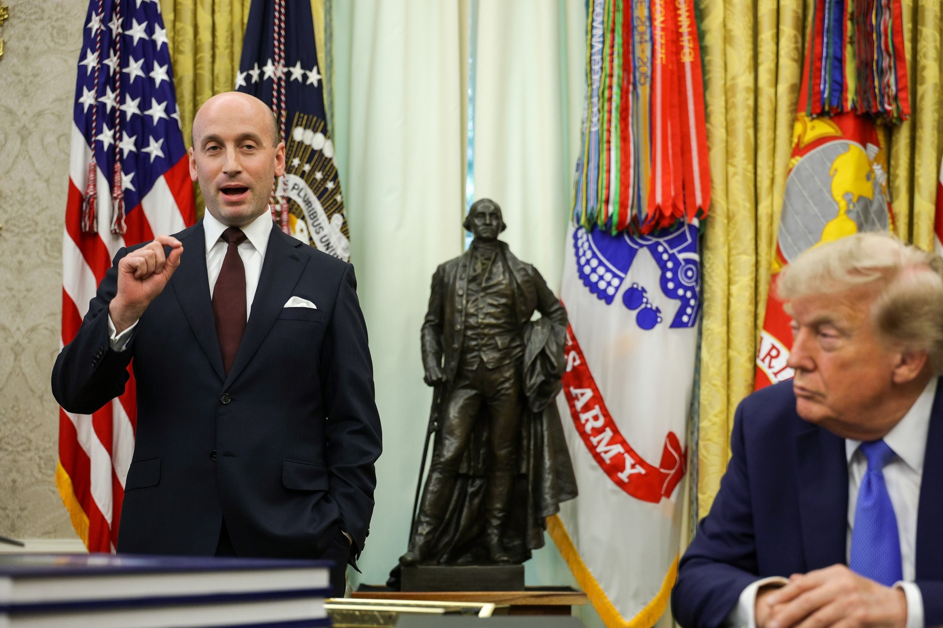White House Deputy Chief of Staff and Homeland Security Advisor Stephen Miller speaks as President Donald Trump listens on during an event in the Oval Office of the White House, August 6, 2026 in Washington.Alex Wong/Getty Images