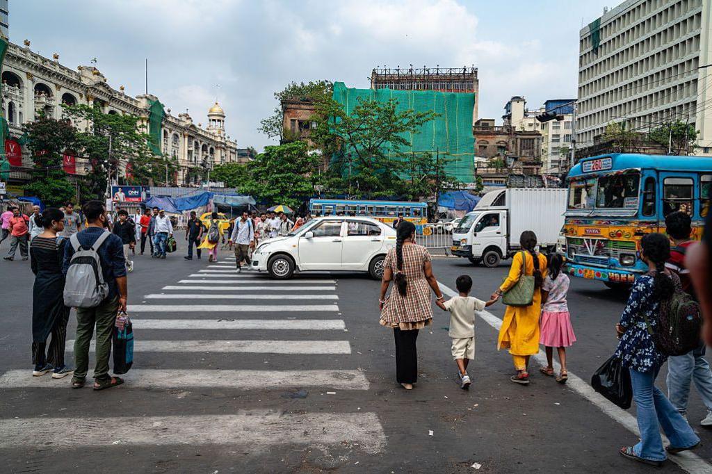 Image caption,Zebra crossings - like this one in Kolkata - are treated as little more than road markings