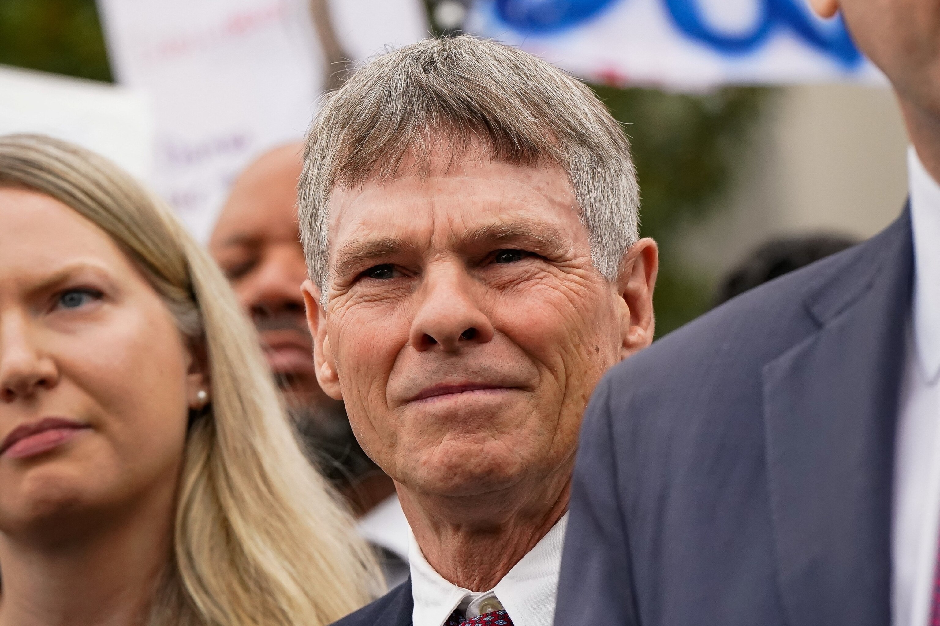 Former U.S. Olympic canoeist David Hearn stands with his lawyer as they speak to reporters following Hearn's arraignment on a felony destruction of property charge related to vandalizing the Lincoln Memorial Reflecting Pool, at DC Superior Court in Washington, July 9, 2026.Elizabeth Frantz/Reuters