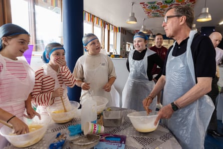 Alan Milburn bakes with local children at a regional youth resource centre in Dublin.Photograph: Patrick Bolger/The Guardian