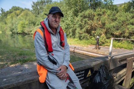 Participants were given nets to trawl the canal for rubbish and thick, green duckweed.Photograph: Tom Pilston/The Guardian