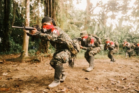 Members of the ELN’s Western War Front take part in military exercises in southern Chocó, Colombia.Photograph: Santiago Mesa/The Guardian