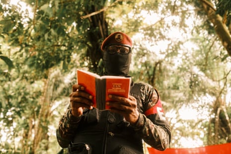 An ELN member operates a drone during exercises at a camp in southern Chocó.Photograph: Santiago Mesa/The Guardian