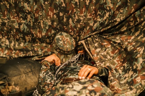 A member of the ELN’s Western War Front rests inside a shelter in southern Chocó.Photograph: Santiago Mesa/The Guardian