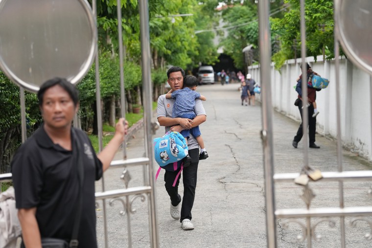 Parents collecting their children from the Debsirin Nonthaburi School following a shooting on Friday.Sakchai Lalit / AP Photo/Sakchai Lalit