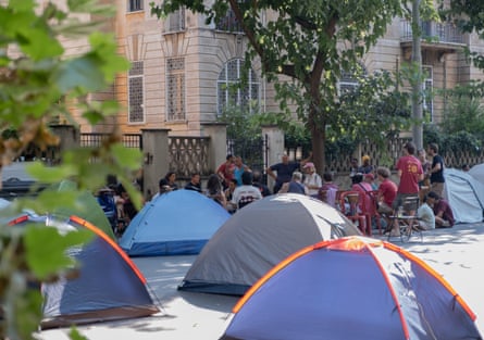 Former residents of the Spin Time Labs building are sleeping in tents in extreme heat.Photograph: Claudia Deganutti