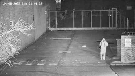 Levy seen walking away from the car park at the back of a store in Tottenham, north London.Photograph: Metropolitan police/PA