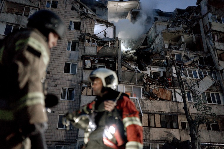 Rescuers work at a nine-story residential building in Kyiv's Podilskyi district after a Russian missile strike in July.Kostiantyn Liberov / Libkos via Getty Images file
