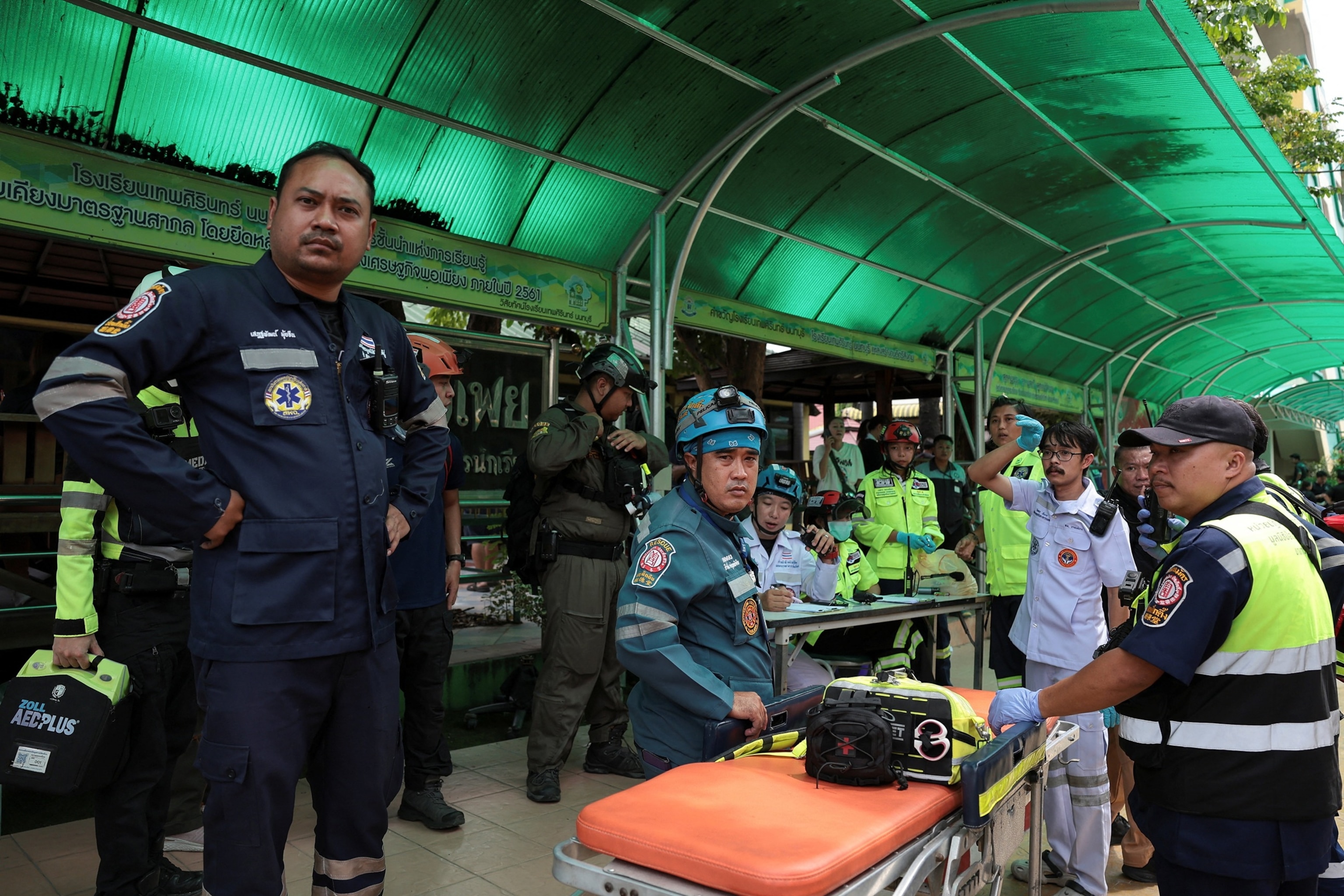 Emergency personnel work at Debsirin Nonthaburi School, the site of a shooting incident, in Bang Kruai, Bangkok, Thailand, August 7, 2026.Chalinee Thirasupa/Reuters