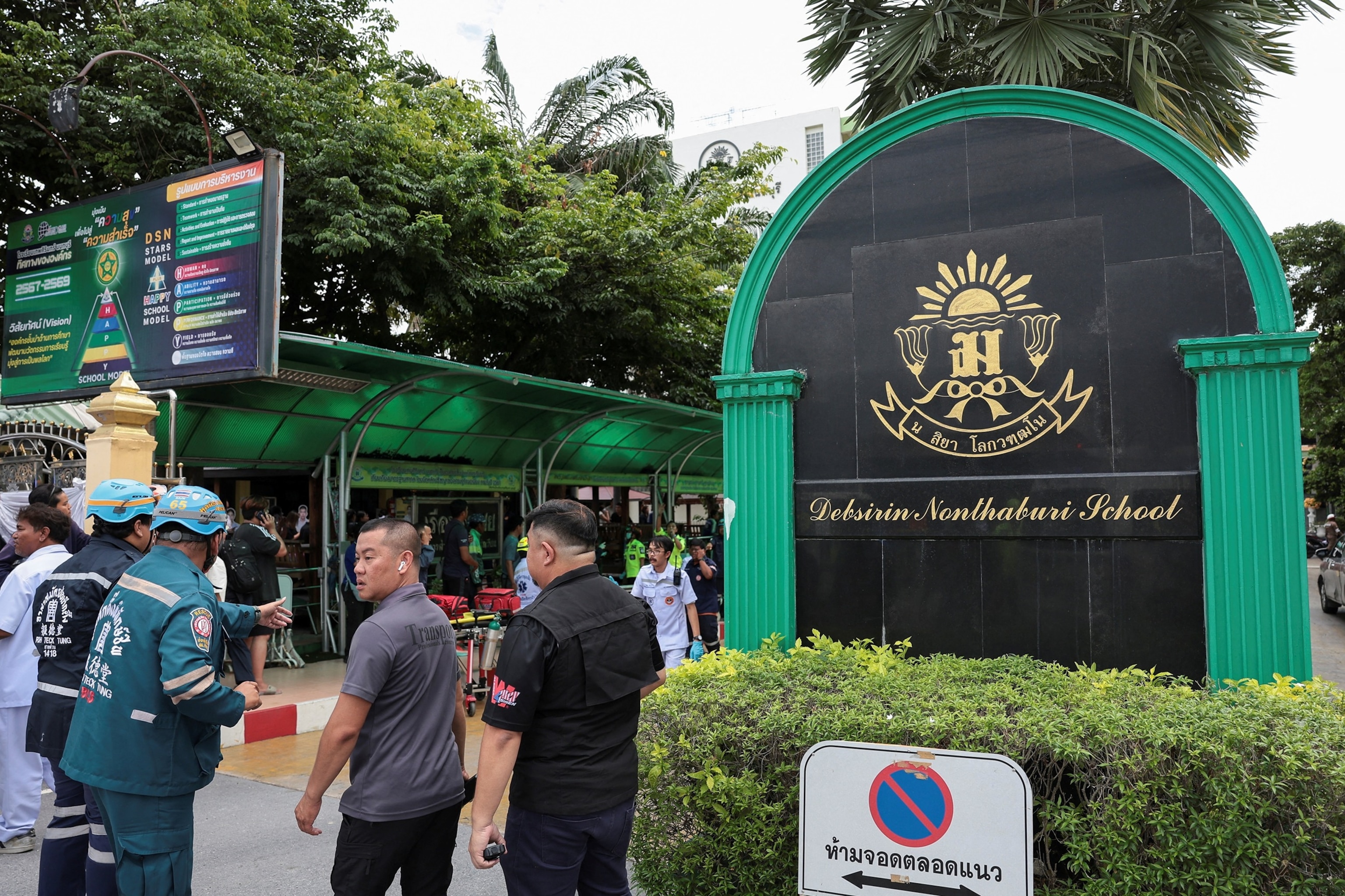 Emergency personnel stand outside Debsirin Nonthaburi School in Bang Kruai district, Bangkok, Thailand, August 7, 2026.Chalinee Thirasupa/Reuters