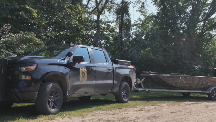 A police vehicle and boat near the Muskegon River in Michigan, where the three tubers went missing.Stringr