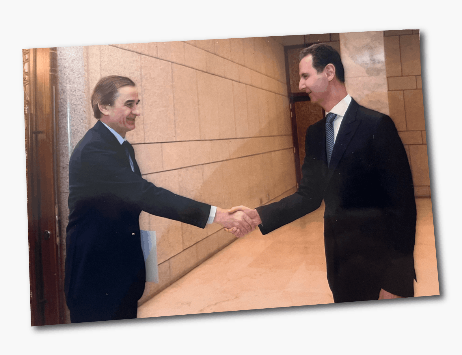 Image caption,One of the photos we found had been copied multiple times - showing Luka shaking hands with Assad