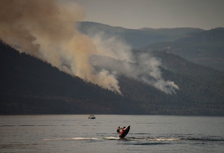 The Quilpituk Creek wildfire in British Columbia, seen here across Okanagan Lake.Photograph: Darryl Dyck/The Canadian Press/AP