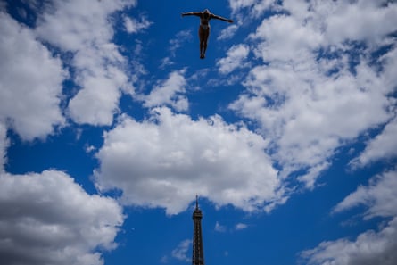 A diver during practice with the Eiffel Tower in the background.Photograph: Aurélien Morissard/AP