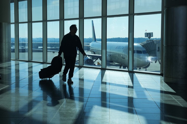 A traveler walks through Hartsfield-Jackson Atlanta International Airport in 2025.Megan Varner / Getty Images