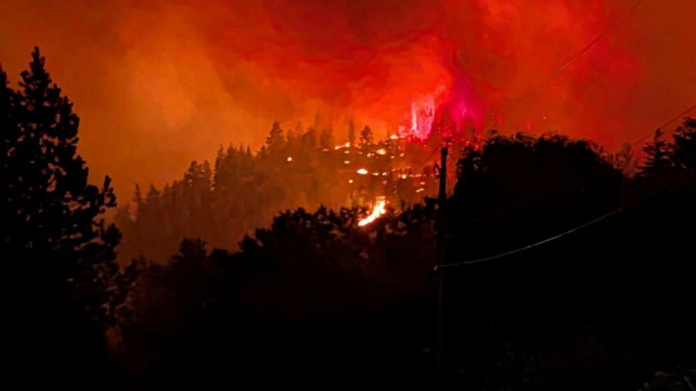 Image caption,The Bald Range wildfire burns, as seen from a vehicle, northwest of Summerland, British Columbia, Canada