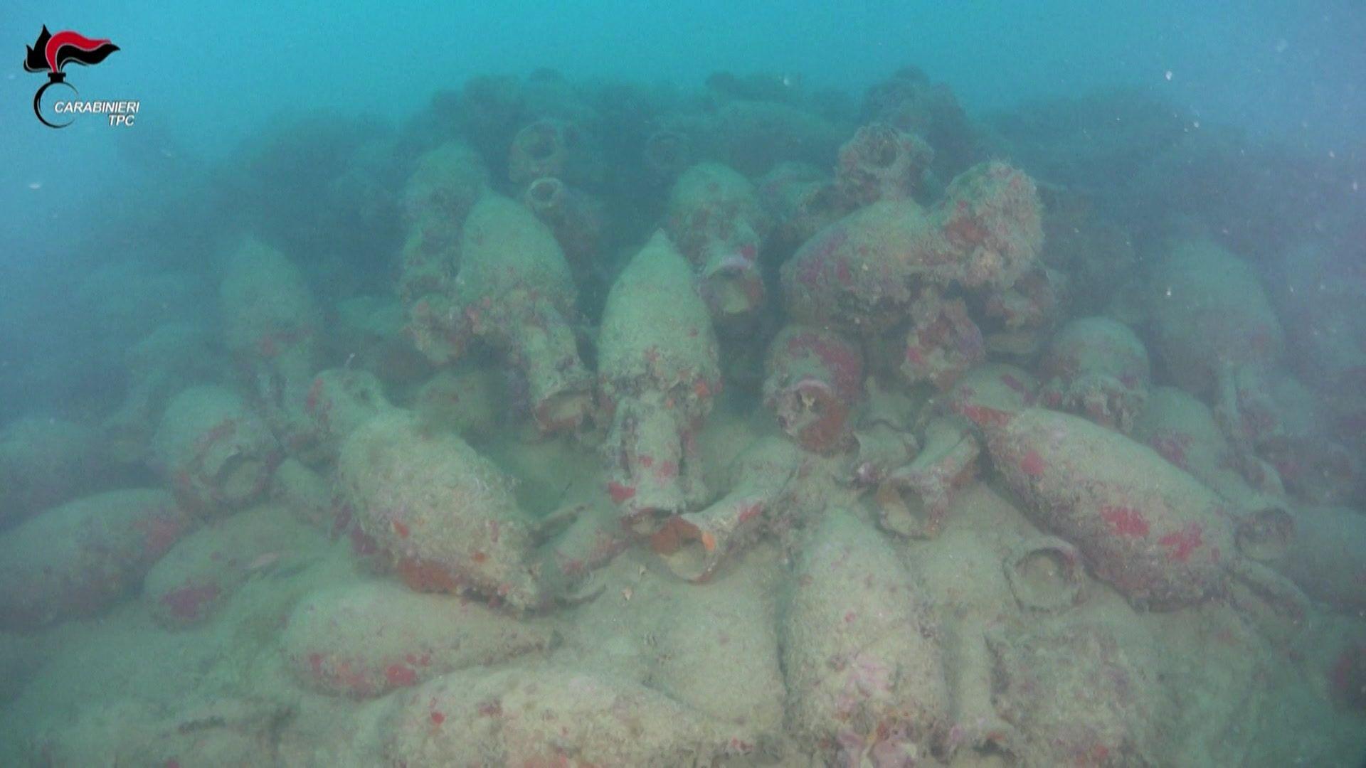 Image caption,Divers from a specialist arm of Italy's police were sent to the site of the wreckage
