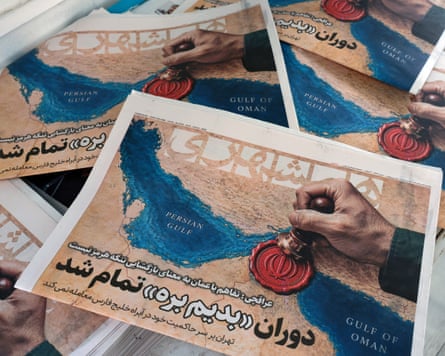 The Hamshahri newspaper carries front-page headline: ‘The Oman deal doesn’t mean the reopening of the strait of Hormuz.’Photograph: Abedin Taherkenareh/EPA
