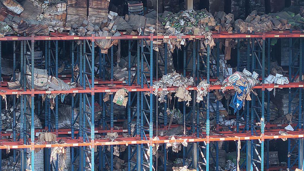 Image caption,Rotting food at the warehouse has attracted rats and flies