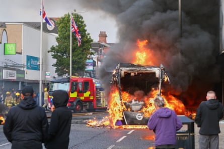 A vehicle set alight during riots in Belfast in June.Photograph: Peter Morrison/AP