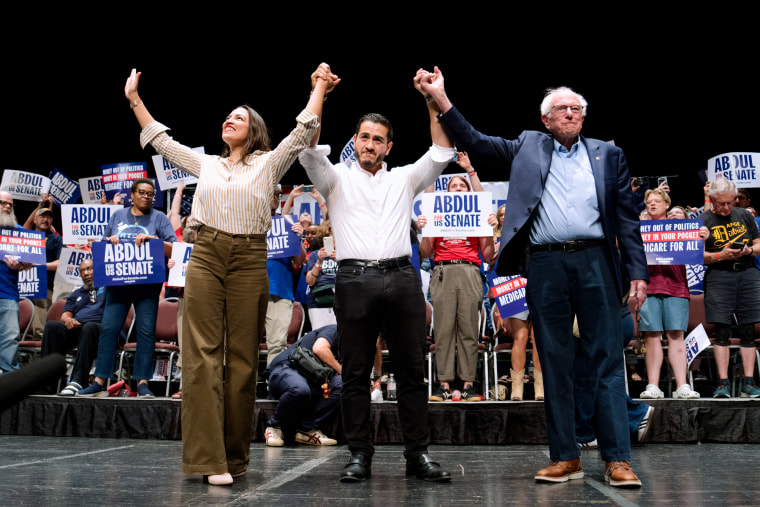 Rep. Alexandria Ocasio-Cortez, D-N.Y., Abdul El-Sayed, D-Mich., and Sen. Bernie Sanders, I-Vt., during a campaign event in Detroit.Nic Antaya / Bloomberg via Getty Images file