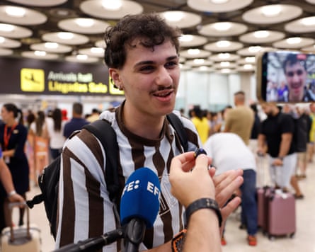 Passengers caught up in the border controls speak to the media in Madrid.Photograph: Chema Moya/EPA