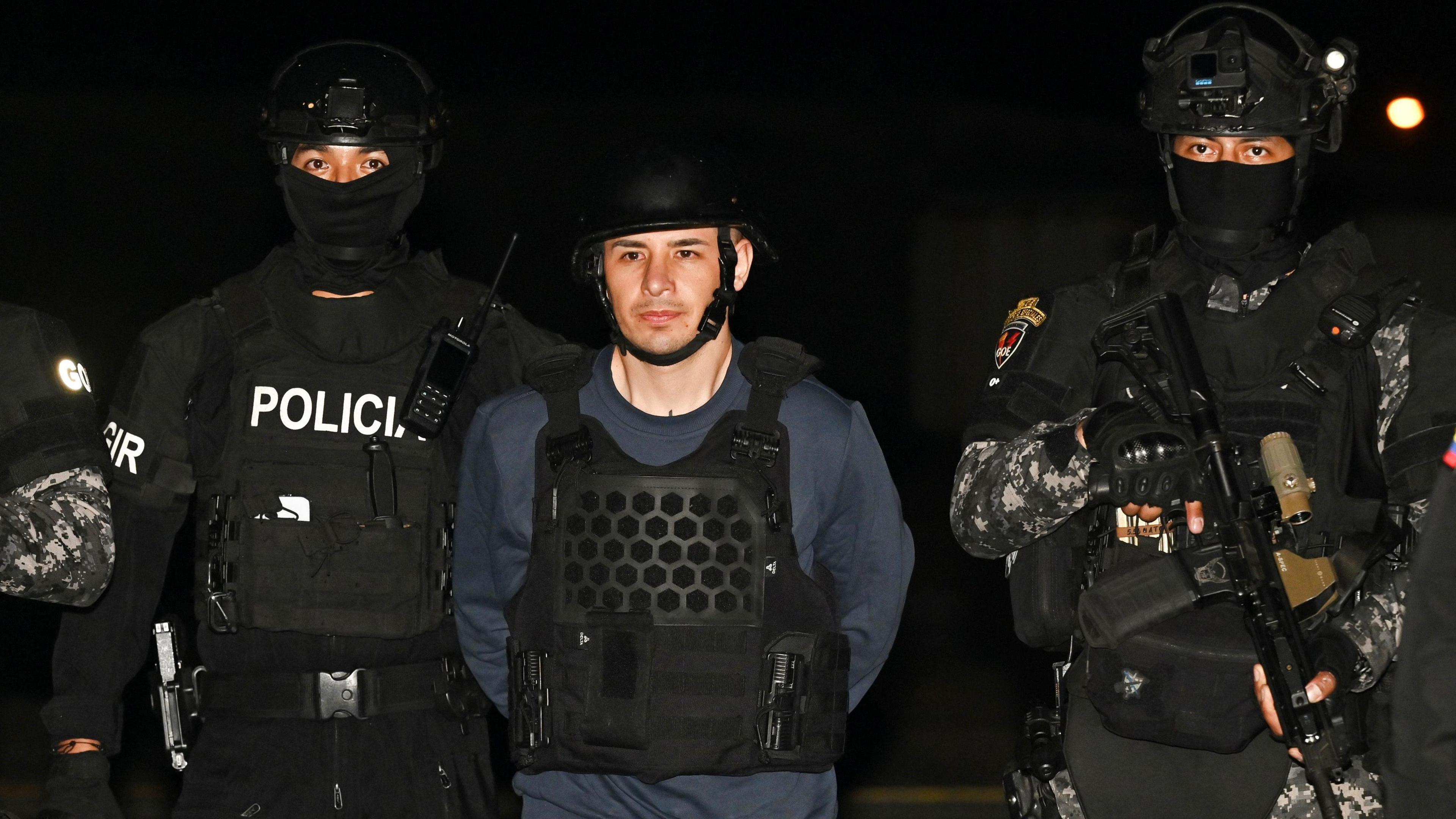 Image caption,Ángel Esteban Aguilar (centre) was arrested in Mexico City in March after fleeing Ecuador