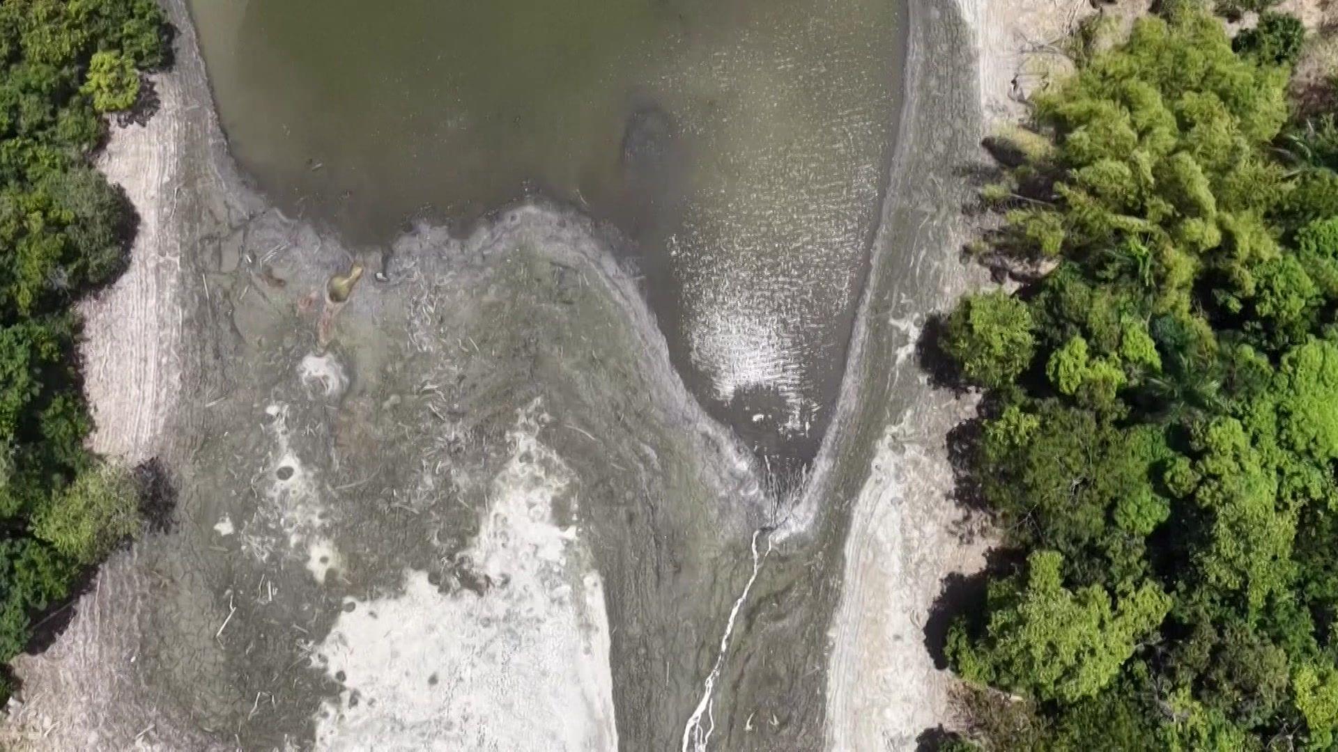 Image caption,Drone footage captured exposed areas of the Carraízo reservoir's bed on Saturday