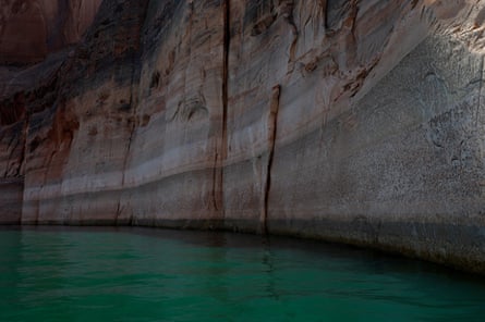 Water lines are visible on the rocky banks of Lake Powell on 1 August 2026 in Page, Arizona.Photograph: Justin Sullivan/Getty Images