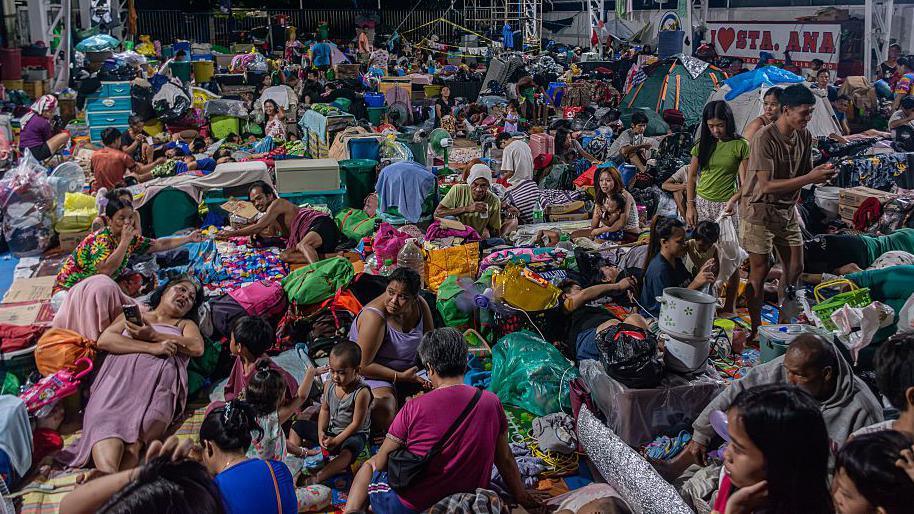 Image caption,More than 7,000 people are sheltering at evacuation centres nationwide in the Philippines