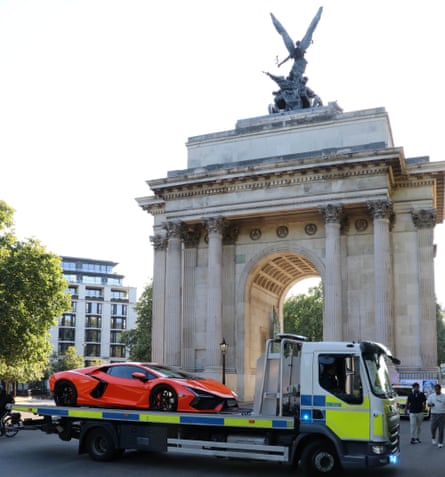 Police tow away a seized Lambourghini Revuelto at Wellington Arch in central London.Photograph: Metropolitan Police/PA