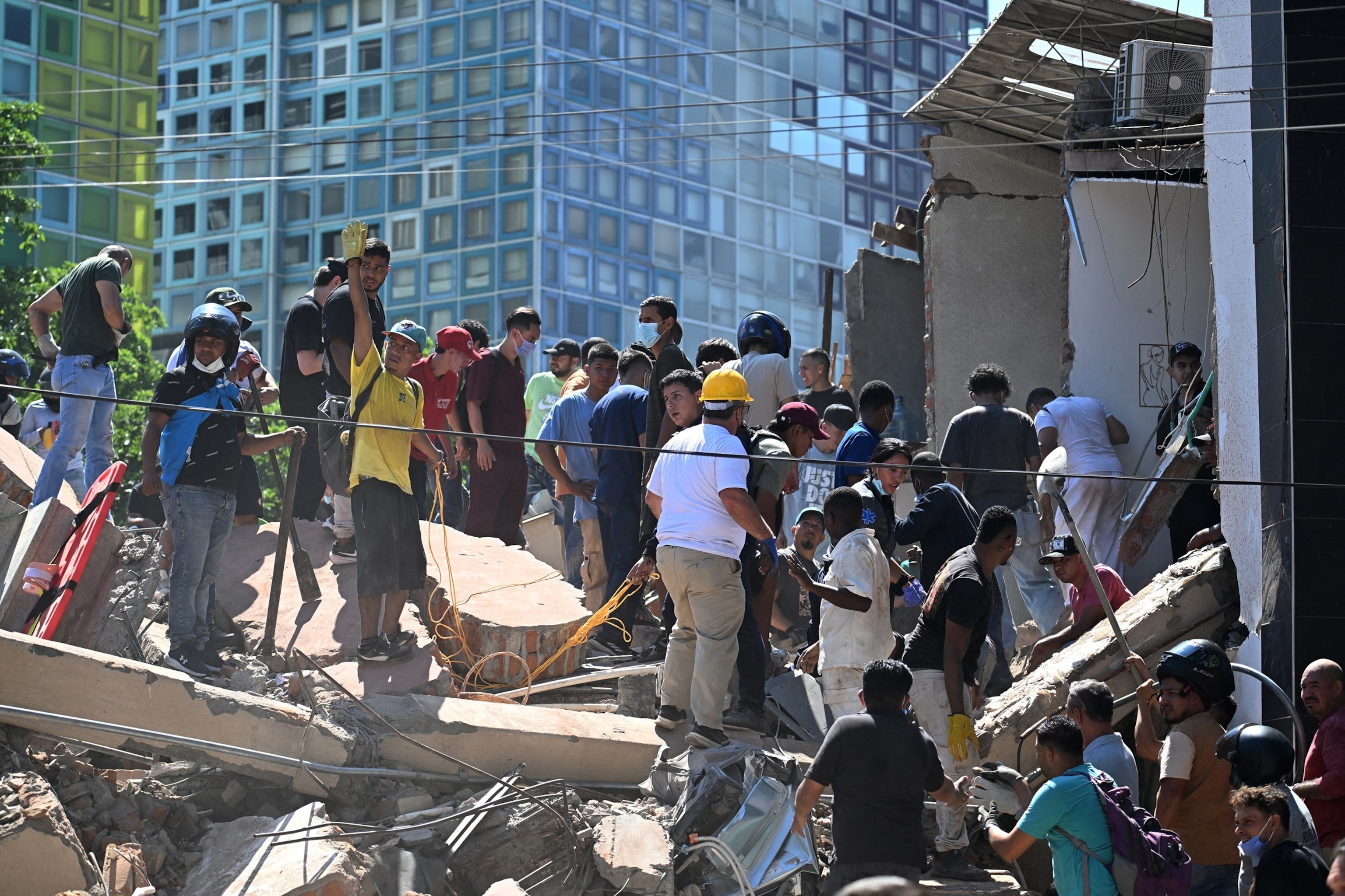 People look for survivors amid the rubble of a collapsed building after an earthquake in Cali, Colombia, Aug. 10, 2026.Joaquin Sarmiento/AFP via Getty Images