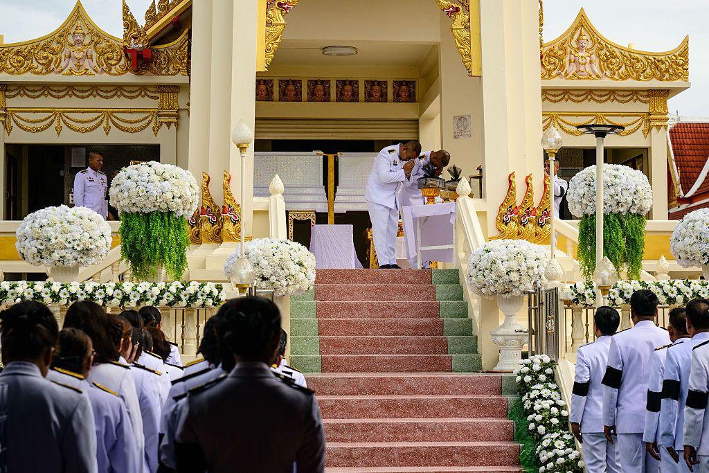 Image caption,Officials paid their respects to the victims on Tuesday at a Nonthaburi temple