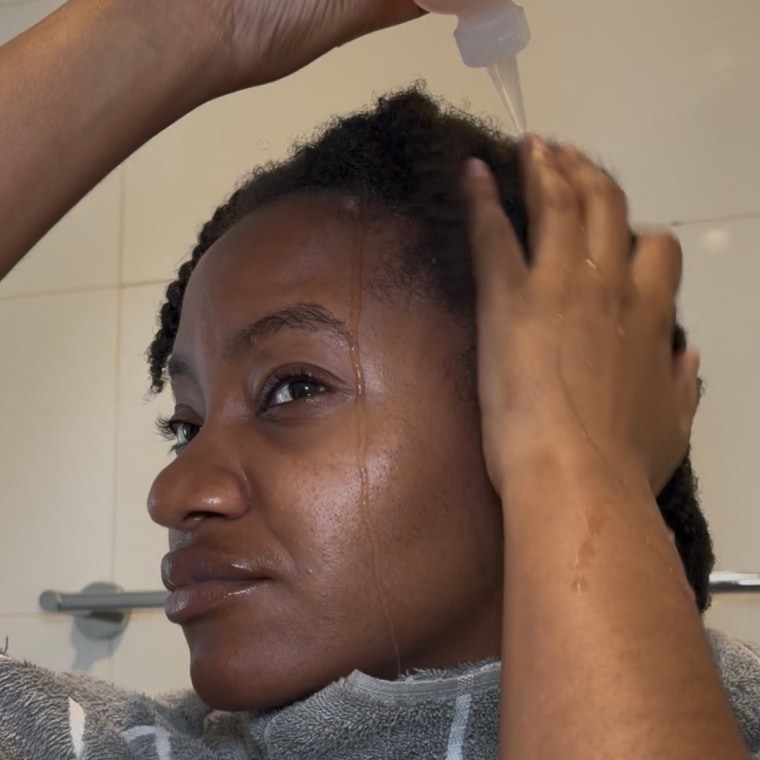The application process is annoying, but the benefits of this Protein Ritual make it worth the hassle, says Morris.Woman applying hair rinse to natural hairCourtesy Ashley Morris