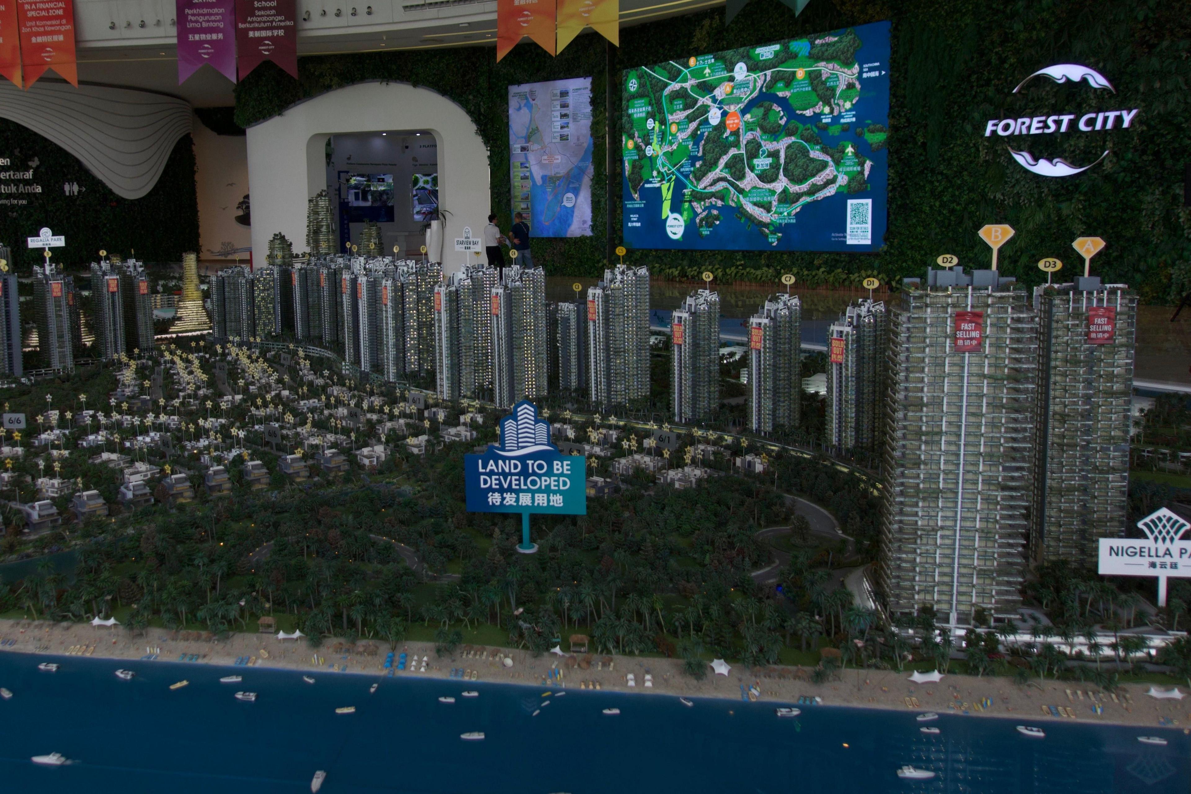 Image caption,Forest City's sales gallery features a gigantic diorama of the complex in miniature