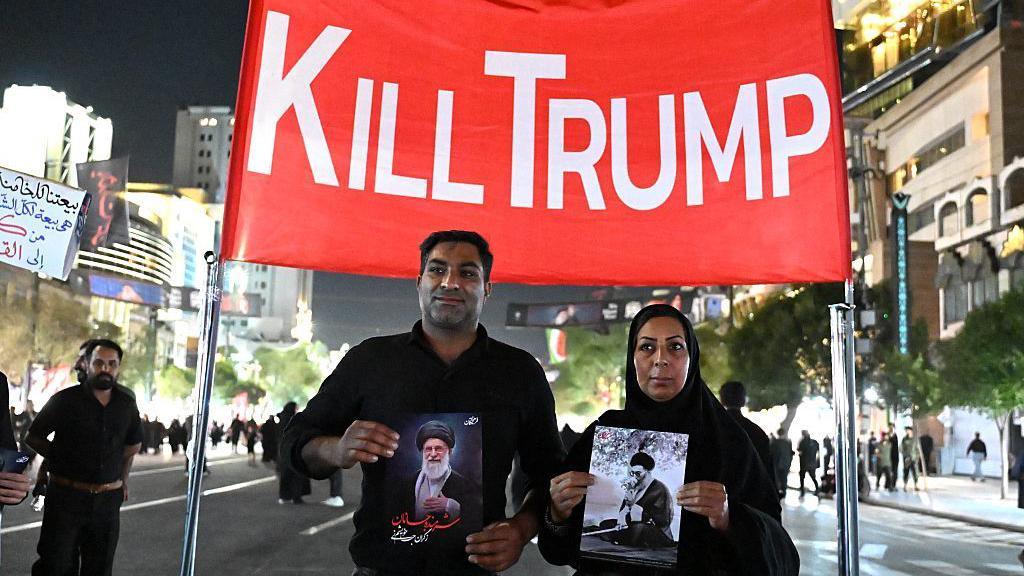 Image caption,Signs calling for Trump's death are often seen during anti-US and anti-Israel rallies in Iran