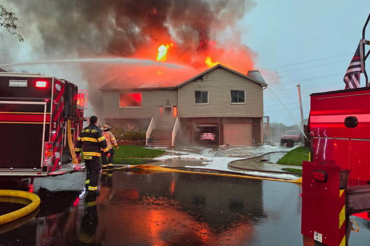 A roof is damaged after a strong storm in Tinley Park, Ill., on Tuesday.Laura Bargfeld / AP