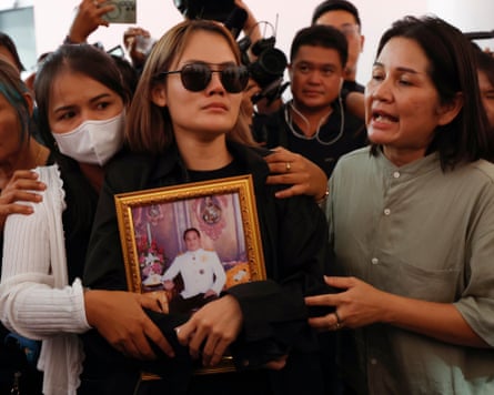 The wife of a teacher killed in the Debsirin Nonthaburi school shooting weeps.Photograph: Rungroj Yongrit/EPA