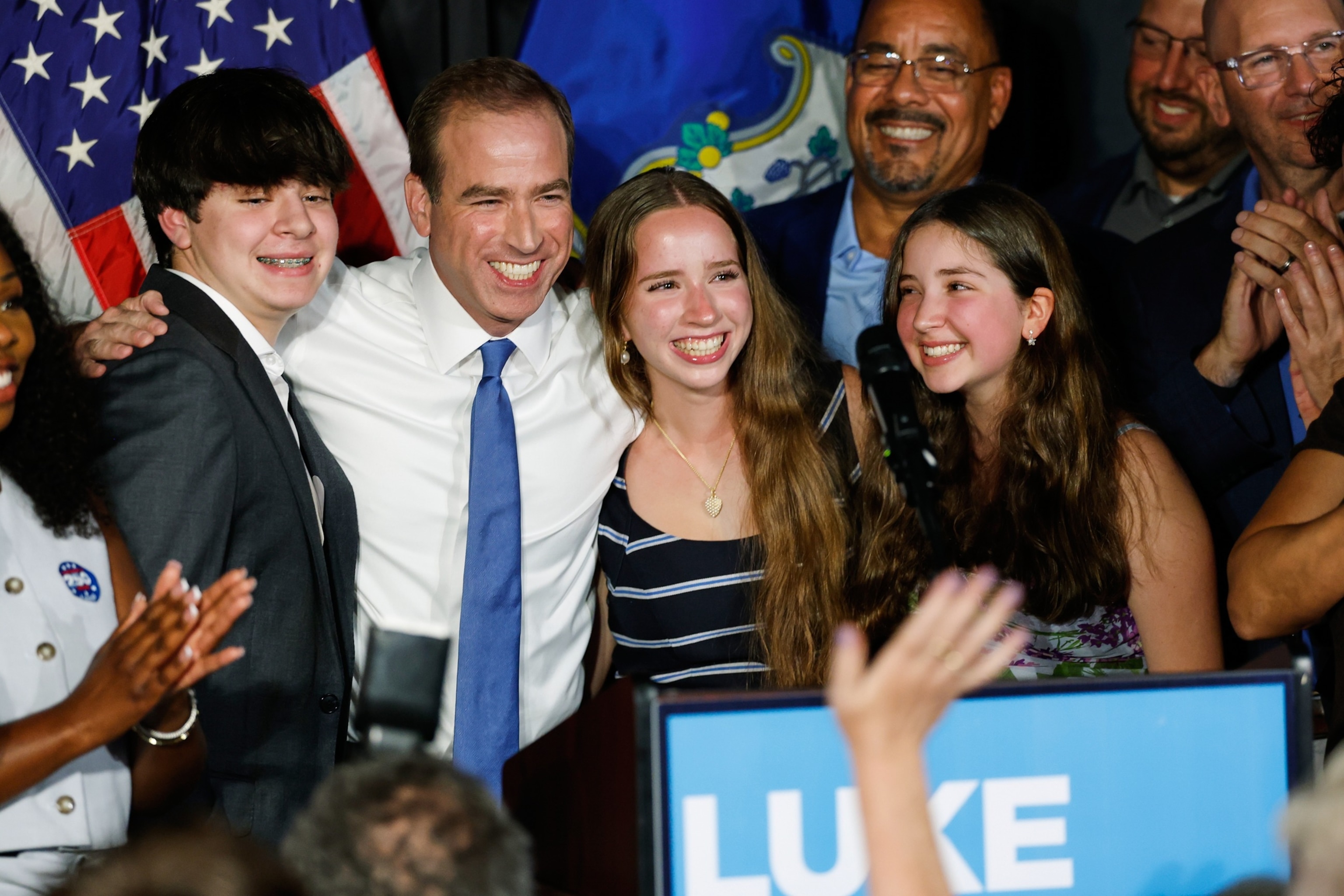 Luke Bronin, former Hartford mayor and Democratic candidate for Connecticut's 1st congressional district, stands on stage with his children during an election night watch party, Aug. 11, 2026, in Hartford, Conn.Rusty Jones/AP Photo