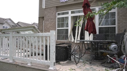 In this image made from video, damage caused by a strong storm is seen at a home in Tinley Park, Illinois, on 11 August.Photograph: Laura Bargfeld/AP