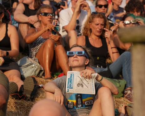 Crowds gather at Monte Stella to watch the solar eclipse in Italy.Photograph: Shutterstock