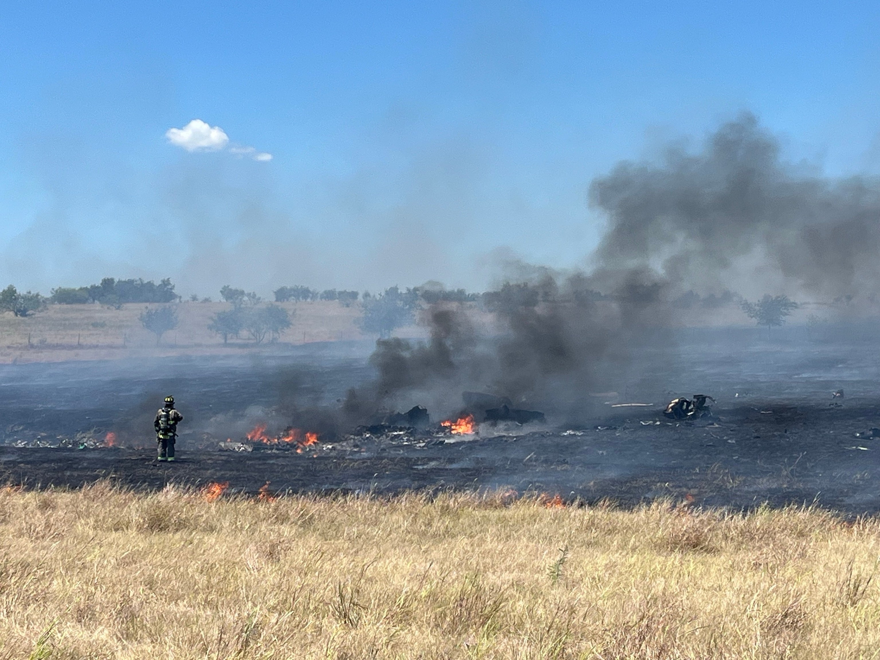 A firefighter at the scene of a military helicopter crash in Salado, Texas, Aug. 12, 2026.Bell County Sheriff's Office
