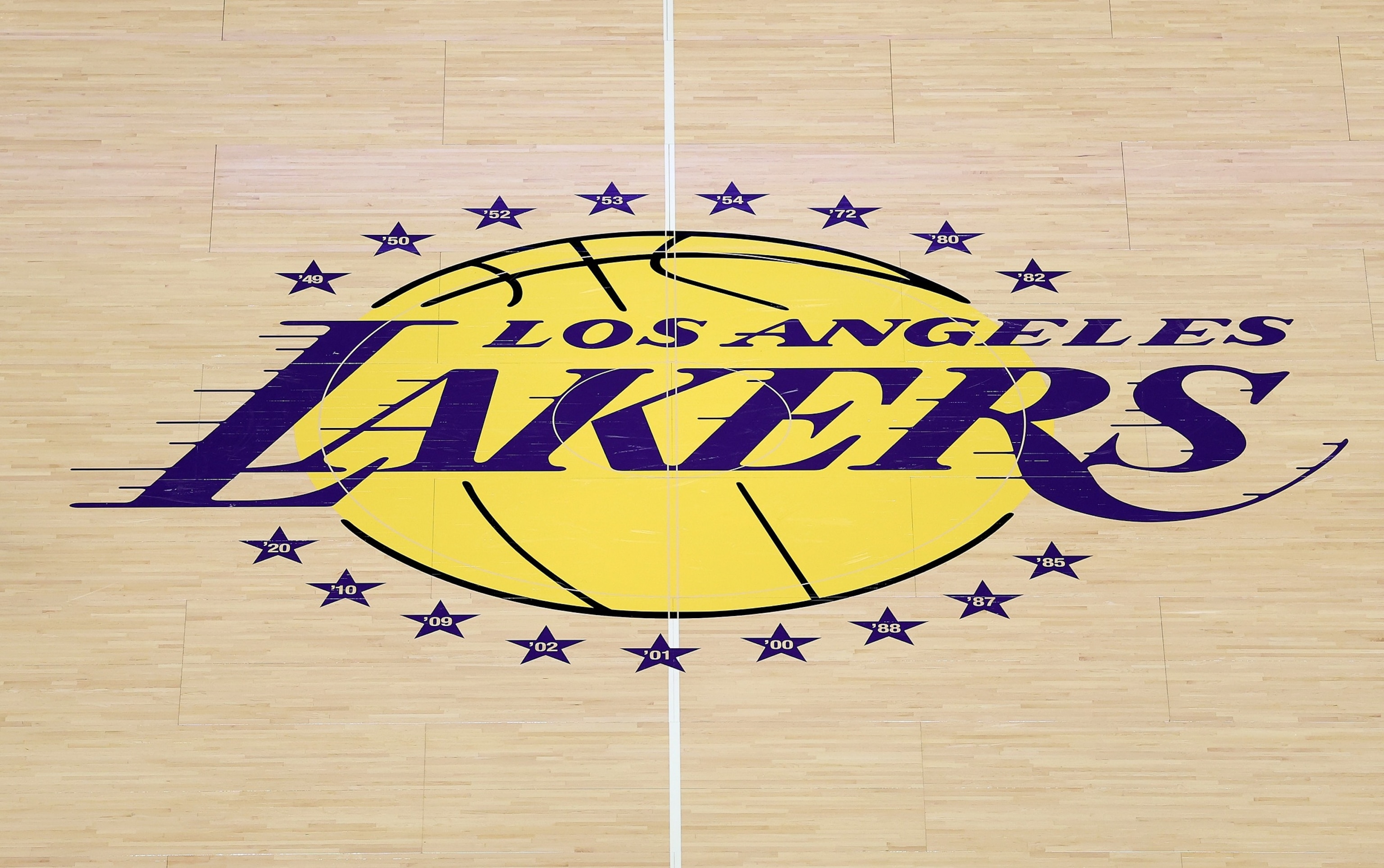 The Los Angeles Lakers logo on the court before the game against the Golden State Warriors, October 21, 2025 in Los Angeles.Luke Hales/Getty Images
