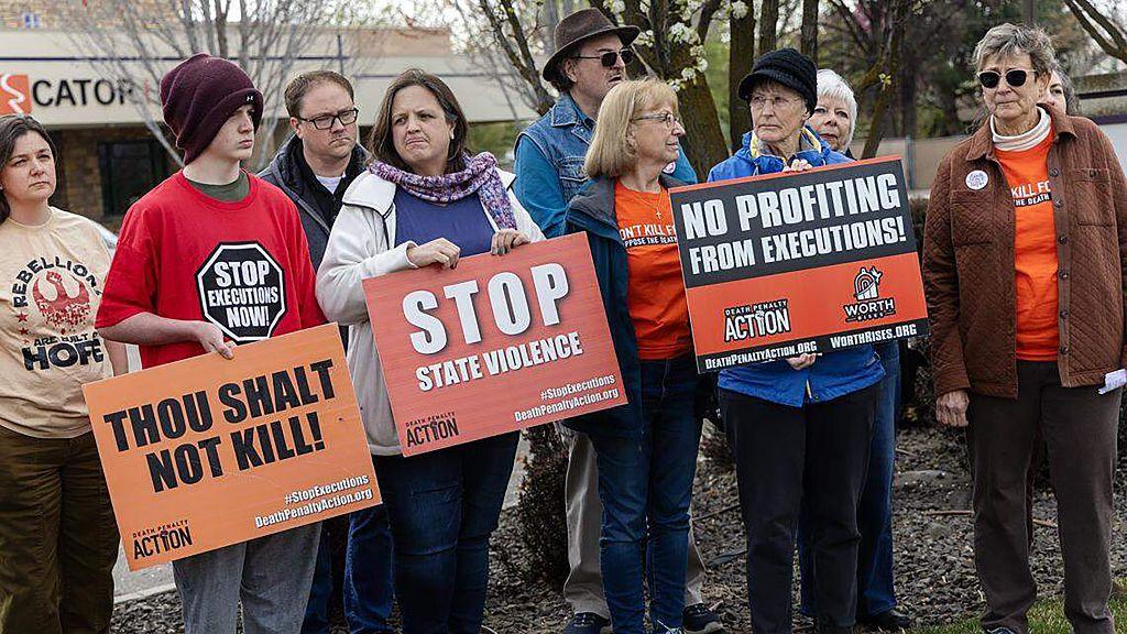 Image caption,People protested Idaho's decision to build a firing-squad execution chamber