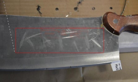 A meat cleaver with ‘kafir’ scratched on to it that was also found under the seat of Naweed Ali’s vehicle.Photograph: West Midlands police/PA