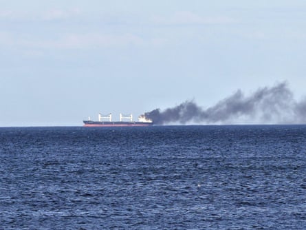 Smoke rises from a ship damaged by a purported Russian attack in the Black Sea last month.Photograph: Ukrinform/Shutterstock